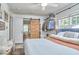 Comfortable main bedroom with a barn door to another room at 216 Northwood Cir, Durham, NC 27701