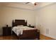 Cozy bedroom with a ceiling fan and a large decorative wooden bed at 221 Grantwood Dr, Holly Springs, NC 27540