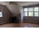 Bonus room with hardwood floors, good natural light, and neutral paint at 221 Grantwood Dr, Holly Springs, NC 27540