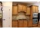 Well-equipped kitchen with custom cabinets, granite countertops, and stainless steel appliances at 221 Grantwood Dr, Holly Springs, NC 27540