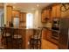 Spacious kitchen with an island, stainless steel appliances, and ample cabinet space at 221 Grantwood Dr, Holly Springs, NC 27540