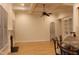 Large living room features a coffered ceiling, fireplace, built-in shelving, and bar seating at 221 Grantwood Dr, Holly Springs, NC 27540