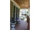 Charming porch featuring brick flooring, comfortable seating, and decorative accents at 221 Grantwood Dr, Holly Springs, NC 27540