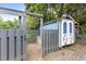 Backyard with a charming shed, garden, and swingset perfect for outdoor activities and storage at 2214 Pathway Dr, Chapel Hill, NC 27516