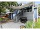 Backyard deck with a grill, seating, and shade, perfect for summer barbecues and entertaining at 2214 Pathway Dr, Chapel Hill, NC 27516