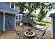 Outdoor living space with a fire pit, chairs, patio and deck, perfect for entertaining guests at 2214 Pathway Dr, Chapel Hill, NC 27516