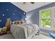 bedroom with playful star decor and a large window offering natural light at 2214 Pathway Dr, Chapel Hill, NC 27516