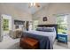 Comfortable bedroom with a bed, wooden chest, and side table with light at 2214 Pathway Dr, Chapel Hill, NC 27516