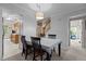 Dining room with a white table and a view of the kitchen and hallway at 2214 Pathway Dr, Chapel Hill, NC 27516