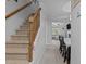 Hallway with staircase leading to a dining area and living room at 2214 Pathway Dr, Chapel Hill, NC 27516