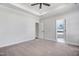 Large bedroom featuring neutral walls and carpet, a ceiling fan, and an en-suite bathroom at 222 Cherrybirch Ln, Zebulon, NC 27597