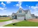 Well-maintained single-Gathering home with a nicely manicured lawn, an attached garage, and a private driveway at 222 Cherrybirch Ln, Zebulon, NC 27597