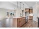 Bright open kitchen with wood cabinets, stainless steel appliances and island that overlooks the living area at 222 Cherrybirch Ln, Zebulon, NC 27597
