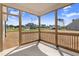 A screened-in porch offering outdoor views and a glimpse of the homes in the surrounding neighborhood at 222 Cherrybirch Ln, Zebulon, NC 27597