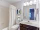 Bathroom with a vanity, toilet, mirror, and a shower with a curtain at 2222 Pathway Dr, Chapel Hill, NC 27516