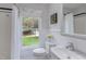 Bright bathroom with white subway tile, wainscoting and a window view at 2222 Pathway Dr, Chapel Hill, NC 27516