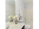 White bathroom with a tile shower/tub, a vanity, and decorative flowers at 2222 Pathway Dr, Chapel Hill, NC 27516