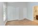 Bedroom with hardwood floors, a window and a closet at 2222 Pathway Dr, Chapel Hill, NC 27516
