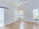 Bright bedroom with vaulted ceilings, barn door access to en-suite bathroom, and ample natural light at 2222 Pathway Dr, Chapel Hill, NC 27516