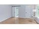 Bright bedroom with stylish barn door access to en-suite bathroom and ample natural light at 2222 Pathway Dr, Chapel Hill, NC 27516