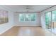 Bright bonus room with ceiling fan, natural light, and sliding doors to the outdoor deck at 2222 Pathway Dr, Chapel Hill, NC 27516