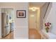 Entryway featuring hardwood floors and view to kitchen at 2222 Pathway Dr, Chapel Hill, NC 27516