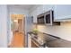 Kitchen featuring stainless steel appliances, granite counters, and white subway tile backsplash at 2222 Pathway Dr, Chapel Hill, NC 27516