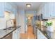 Kitchen featuring stainless steel appliances, granite counters, and white subway tile backsplash at 2222 Pathway Dr, Chapel Hill, NC 27516