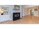 Open-concept living space showcasing a fireplace and built-in shelving connecting to the dining and kitchen areas at 2222 Pathway Dr, Chapel Hill, NC 27516