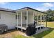 Covered back porch for entertaining or dining with backyard views at 224 Grameta Ln, Lillington, NC 27546