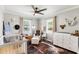 Adorable Bedroom with wood-look floors, crib, accent rug, and neutral paint at 224 Grameta Ln, Lillington, NC 27546
