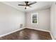 Cozy bedroom with wood flooring, a bright window, and a modern ceiling fan at 224 Grameta Ln, Lillington, NC 27546