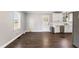 Eat-in kitchen featuring white cabinets, stainless steel appliances, and backyard access at 224 Grameta Ln, Lillington, NC 27546