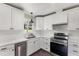 Modern kitchen with new appliances, white cabinets, marble countertops, and stainless steel dishwasher at 224 Grameta Ln, Lillington, NC 27546