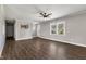Neutral living room with a ceiling fan, laminate wood floors, and a large window for natural light at 224 Grameta Ln, Lillington, NC 27546