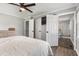 Main bedroom featuring a ceiling fan, neutral color walls, and ensuite bathroom at 224 Grameta Ln, Lillington, NC 27546