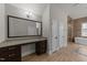 Bathroom with a vanity and sink adjacent to the glass shower and soaker tub at 228 Cloverdale Rd, Apex, NC 27523