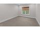 Bedroom featuring neutral carpet, freshly painted walls, and natural light at 228 Cloverdale Rd, Apex, NC 27523