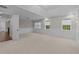 Large bonus room with tray ceiling, neutral carpeting and three windows at 228 Cloverdale Rd, Apex, NC 27523