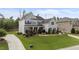 Charming two-story home with gray siding, black shutters, and a beautifully landscaped front yard at 228 Cloverdale Rd, Apex, NC 27523
