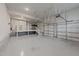 Spacious three car garage with sealed floors and stairs to storage space at 228 Cloverdale Rd, Apex, NC 27523