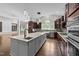 Beautiful kitchen featuring a central island with sink and stainless appliances at 228 Cloverdale Rd, Apex, NC 27523