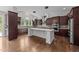 Spacious kitchen with an island, stainless steel appliances, and plenty of cabinet space at 228 Cloverdale Rd, Apex, NC 27523
