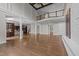 Open floor plan featuring hardwood floors, decorative columns, and staircase at 228 Cloverdale Rd, Apex, NC 27523