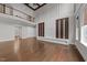 Large living room featuring hardwood floors, and decorative fireplace at 228 Cloverdale Rd, Apex, NC 27523