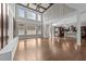 Spacious living room with high ceilings, hardwood floors, large windows, and an open floorplan at 228 Cloverdale Rd, Apex, NC 27523