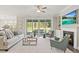 Bright and airy living room boasts a fireplace, built-in shelving, and access to an outdoor patio at 23 W Victoria Ridge Dr # 33, Selma, NC 27576