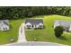 Ariel view of a charming home, with lush green lawn and mature trees at 236 Katie Dr, Rocky Mount, NC 27803