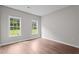 Bright bedroom features two windows and wood-look flooring at 236 Katie Dr, Rocky Mount, NC 27803