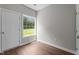 Bright bedroom features a window with a view and wood-look flooring at 236 Katie Dr, Rocky Mount, NC 27803